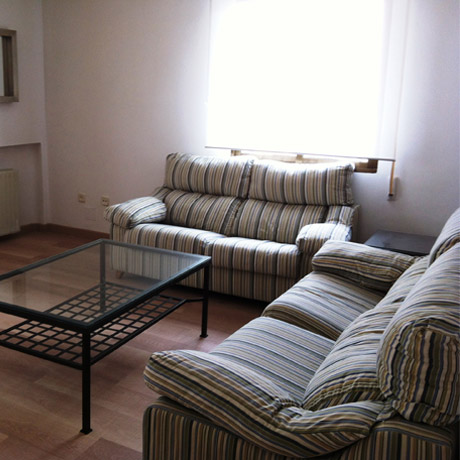 Spacious and furnished living room of the apartment for rent in Madrid in the Proinca Lerida Building