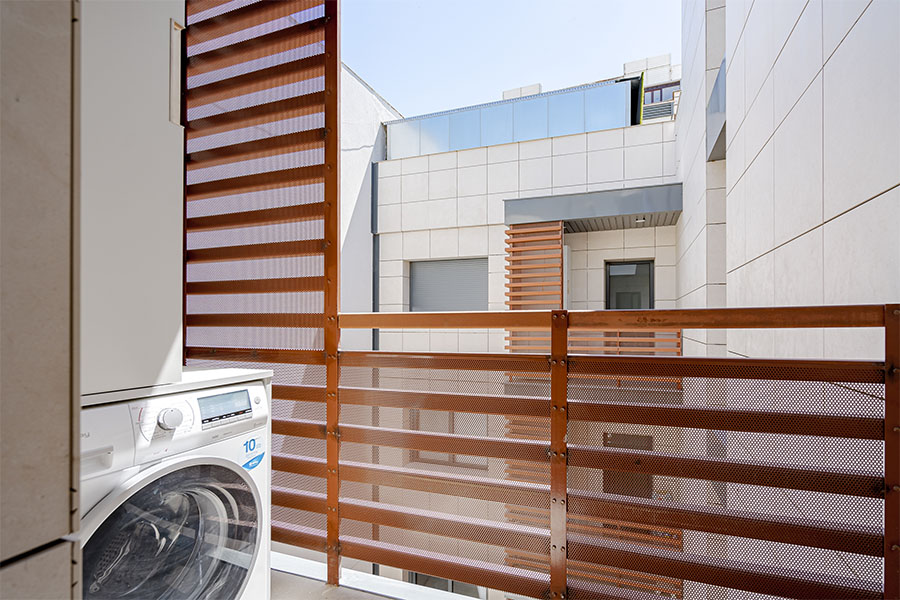 laundry terrace with washer-dryer in the 2-bedrooms penthouse D of the Proinca Moncloa Building
