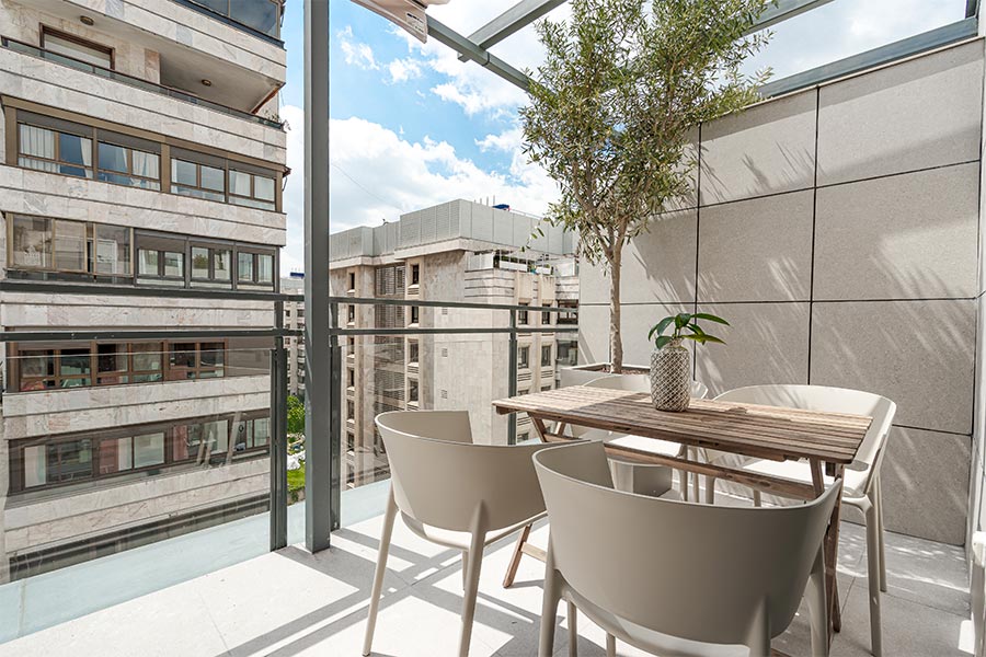 Terrace dining room area of 2-bedrooms penthouse B of the Proinca Moncloa Building